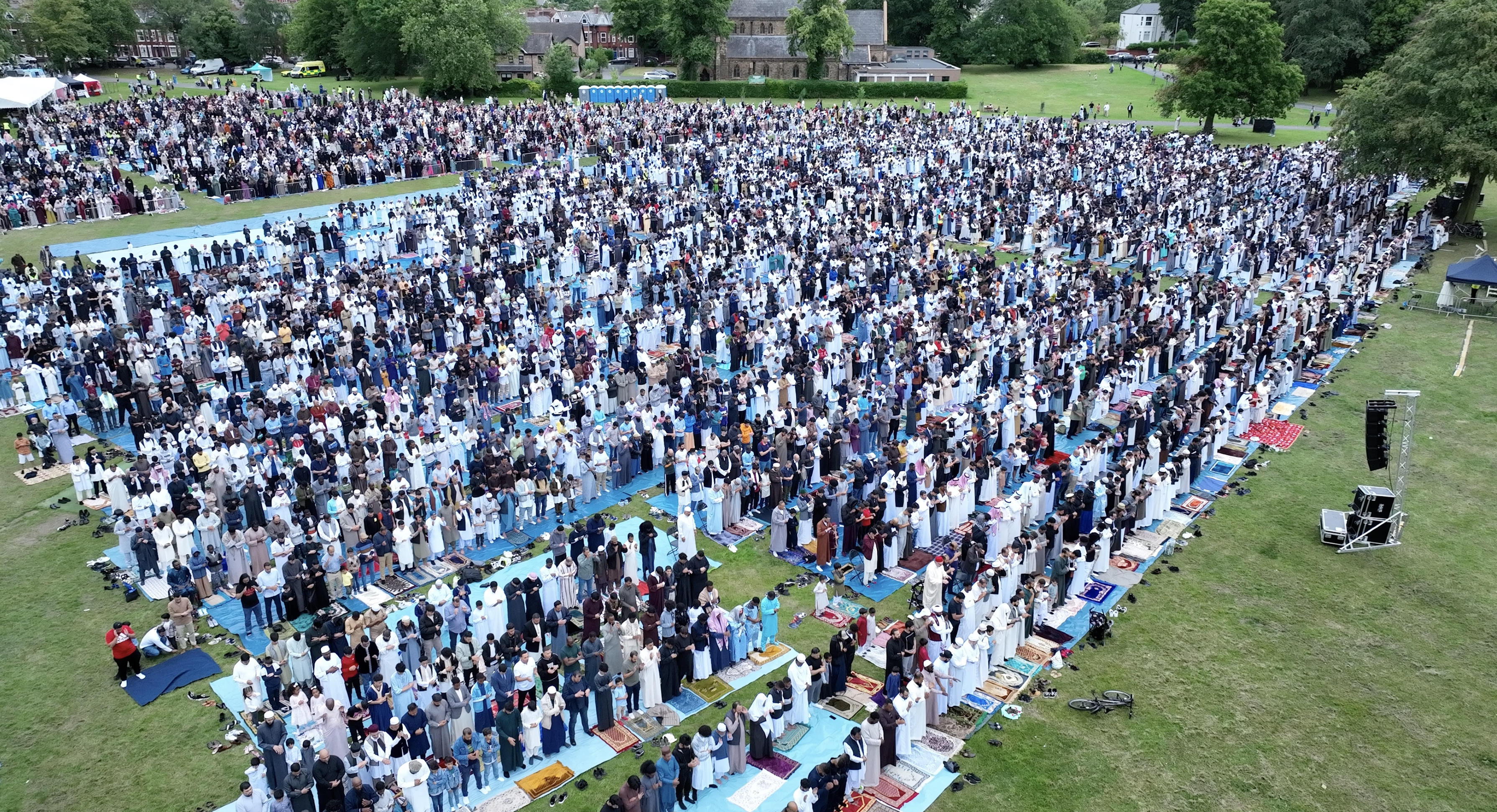 Aerial view of a large Eid gathering in the park